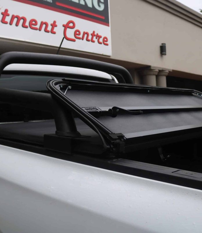 Hard tri fold tonneau cover installed on bakkie load bin
